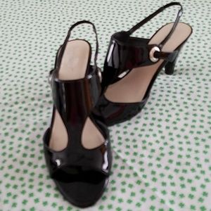 Black patent leather sandals.